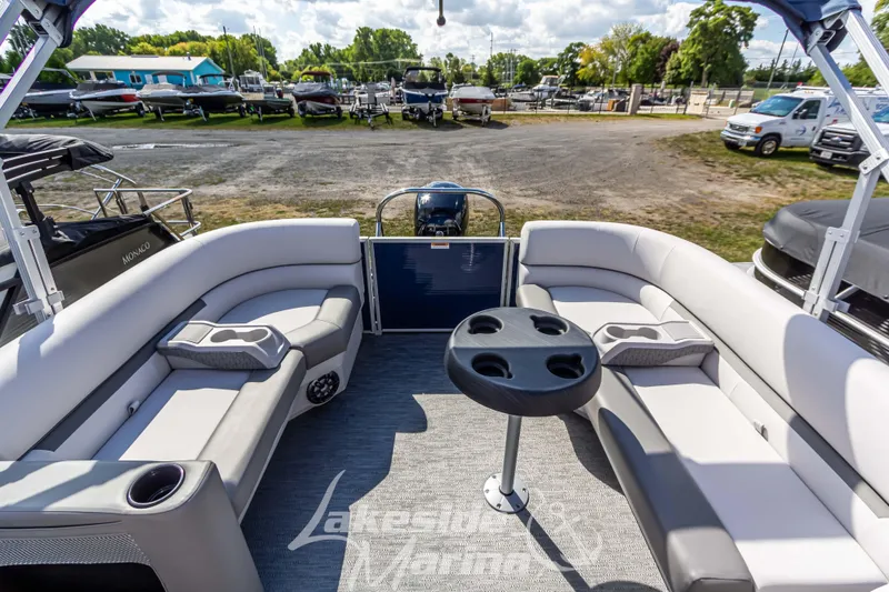 Slide: The Image of 2024 Godfrey Sweetwater 2286 SBX pontoon boat interior with seating and table. - 26