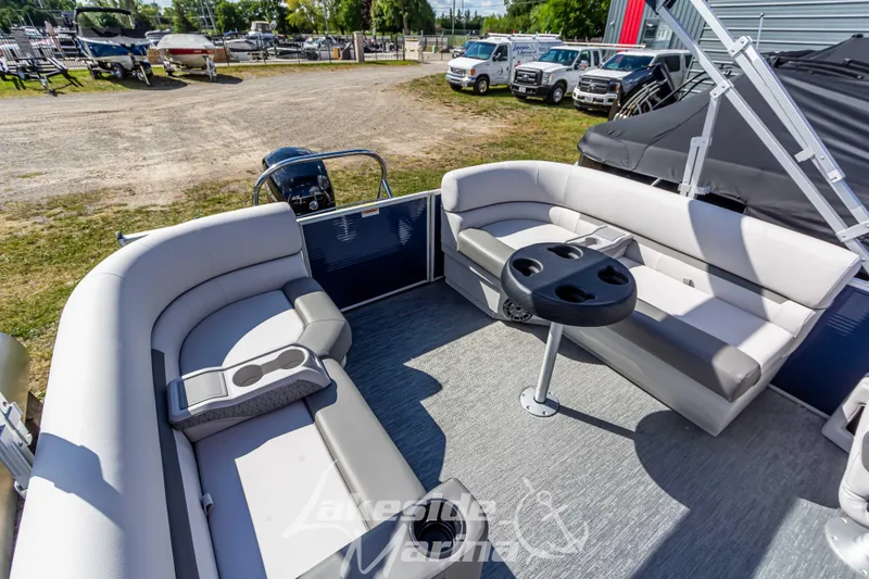 Slide: The Image of 2024 Godfrey Sweetwater 2286 SBX pontoon boat interior with seating and cup holders. - 28