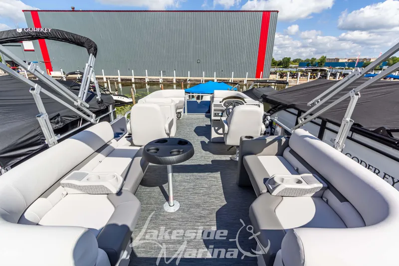 Slide: The Image of 2024 Godfrey Sweetwater 2286 SBX pontoon boat interior with seating and helm. - 33