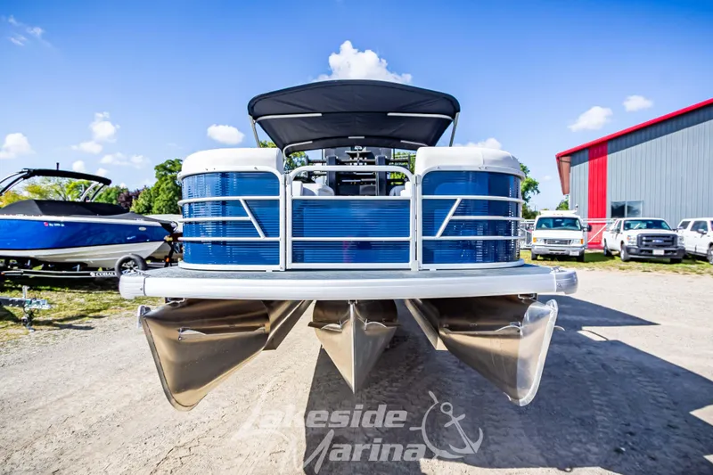 Slide: The Image of 2024 Godfrey Sweetwater 2286 SBX pontoon boat at marina, sunny day. - 7