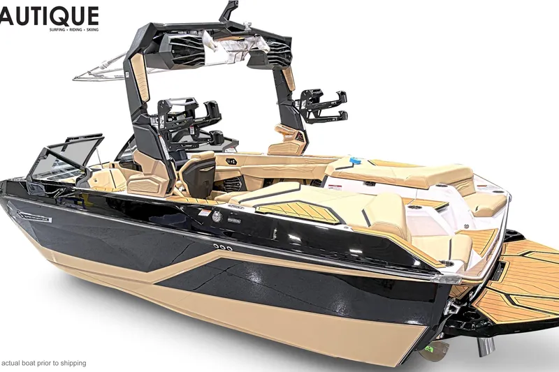 Slide: The Image of 2026 Nautique Super Air Nautique G23 boat, sleek design, luxury interior, black and tan color scheme. - 2