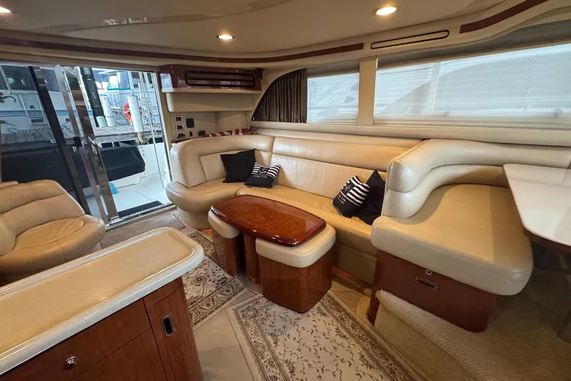 Slide: The Image of Luxurious interior of 2003 Sea Ray 480 Sedan Bridge yacht with plush seating and elegant decor. - 17