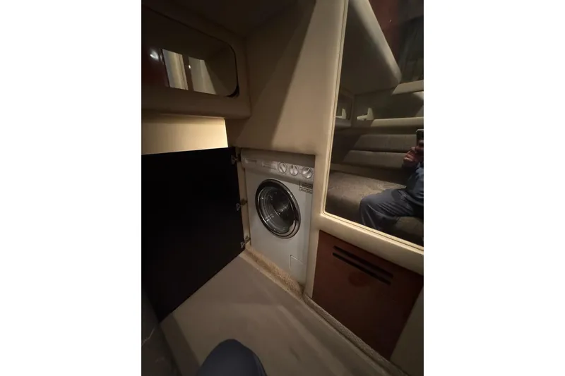 Slide: The Image of Interior of 2003 Sea Ray 480 Sedan Bridge with built-in washing machine. - 25