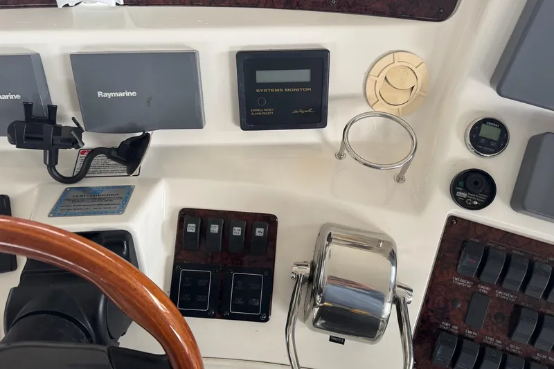 Slide: The Image of Control panel of a 2003 Sea Ray 480 Sedan Bridge with Raymarine electronics. - 32