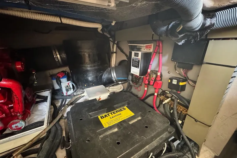 Slide: The Image of Engine room of 2003 Sea Ray 480 Sedan Bridge with battery and wiring components. - 43