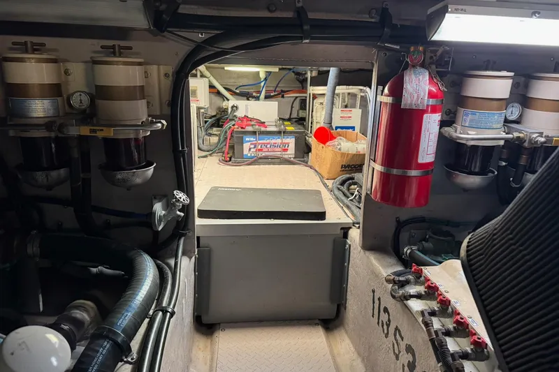 Slide: The Image of Engine room of 2003 Sea Ray 480 Sedan Bridge with equipment and fire extinguisher. - 53