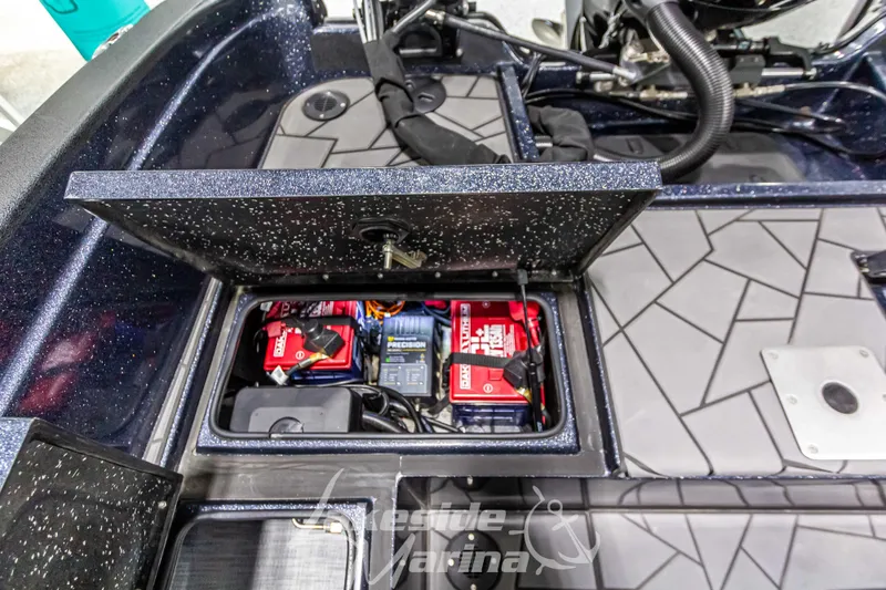 Slide: The Image of Open battery compartment of 2024 Recon 2185 SC boat. - 20
