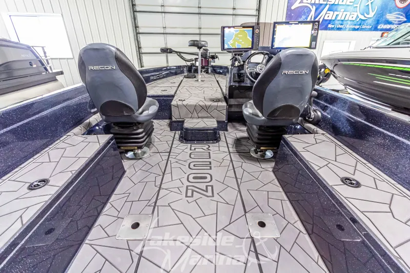 Slide: The Image of Interior of 2024 Recon 2185 SC boat with modern seats and controls. - 23