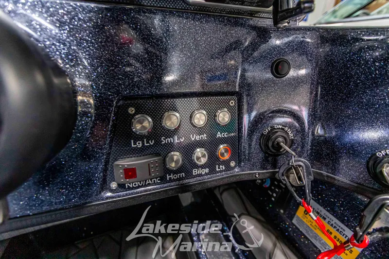 Slide: The Image of 2024 Recon 2185 SC boat dashboard with control panel. - 29