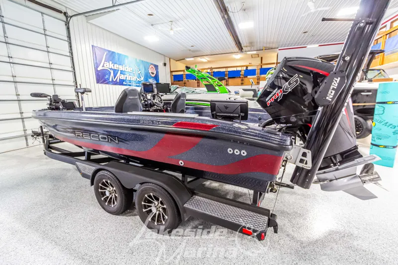 Slide: The Image of 2024 Recon 2185 SC boat in a showroom. - 3