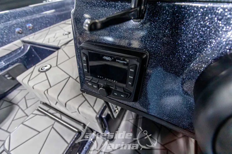 Slide: The Image of 2024 Recon 2185 SC boat dashboard with controls. - 30