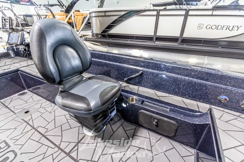 Slide: The Image of 2024 Recon 2185 SC boat with seat and storage. - 33