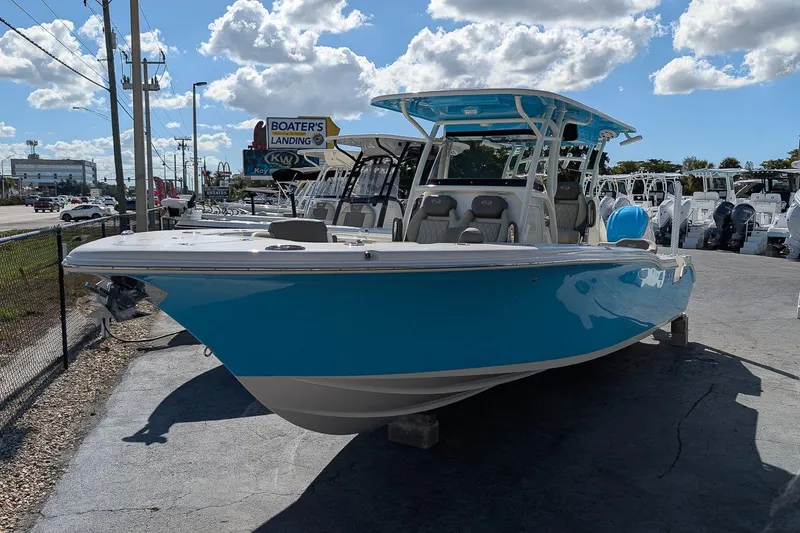 The Image of 2026 Key West 291 FS boat in vibrant blue, displayed at Boater's Landing under a sunny sky. - 0