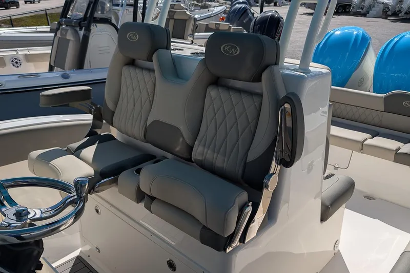 Slide: The Image of 2026 Key West 291 FS boat interior with luxurious seating and modern steering wheel. - 12