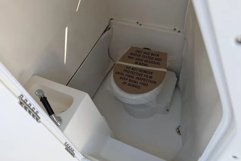 Slide: The Image of Interior of 2026 Key West 291 FS boat with toilet and protective film. - 15