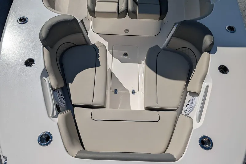 Slide: The Image of 2026 Key West 291 FS boat interior with cushioned seating and cup holders. - 18