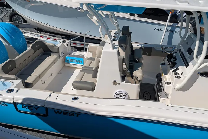 Slide: The Image of 2026 Key West 291 FS boat with spacious seating and modern design. - 20