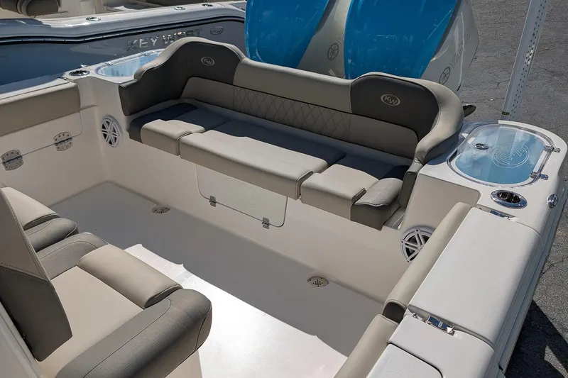 Slide: The Image of 2026 Key West 291 FS boat interior with cushioned seating and storage compartments. - 6