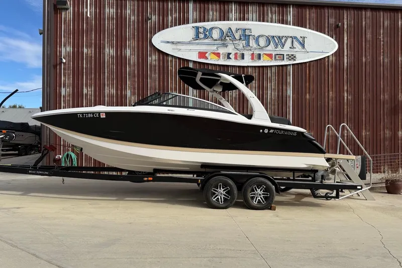 The Image of 2014 Four Winns SL242 boat on trailer at Boat Town dealership. - 0
