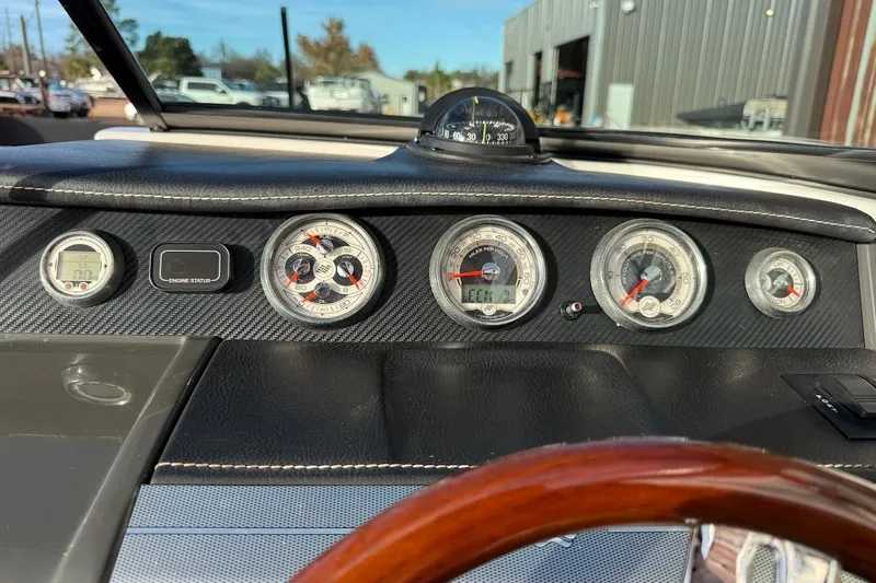 Slide: The Image of Dashboard of 2014 Four Winns SL242 boat with gauges and compass. - 12