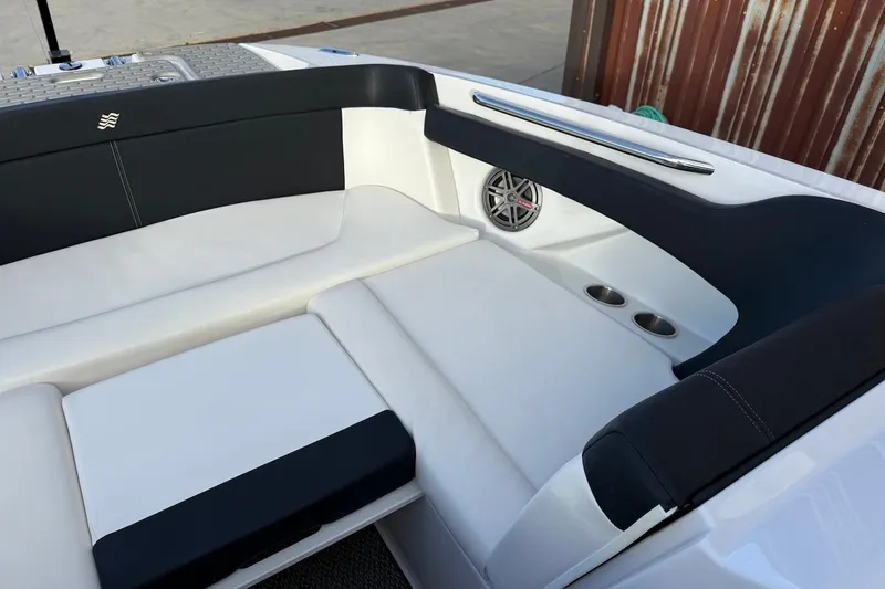 Slide: The Image of 2014 Four Winns SL242 boat interior with sleek seating and built-in cup holders. - 16