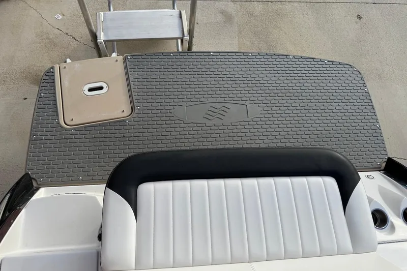 Slide: The Image of 2014 Four Winns SL242 boat swim platform with textured mat and seating. - 4