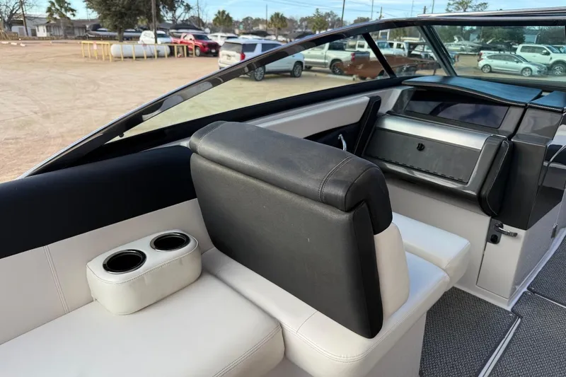 Slide: The Image of 2014 Four Winns SL242 boat interior with seating and cup holders. - 7