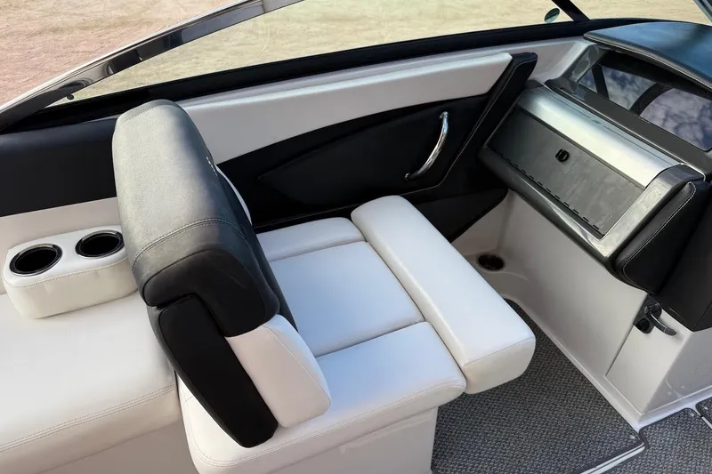 Slide: The Image of 2014 Four Winns SL242 boat interior with white seating and cup holders. - 9