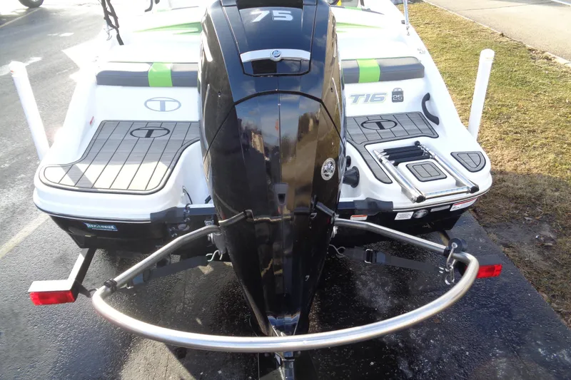 Slide: The Image of 2023 Tahoe T16 boat with powerful outboard motor, rear view on trailer. - 10