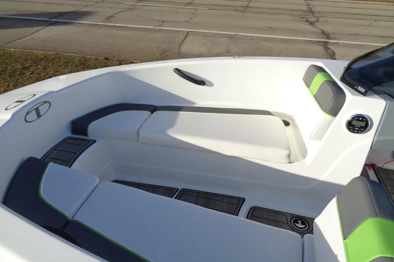 Slide: The Image of 2023 Tahoe T16 boat interior with white and green seating, modern design. - 16
