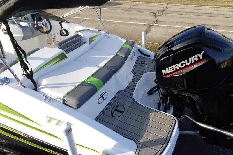 Slide: The Image of 2023 Tahoe T16 boat with Mercury engine, featuring sleek seating and modern design. - 6