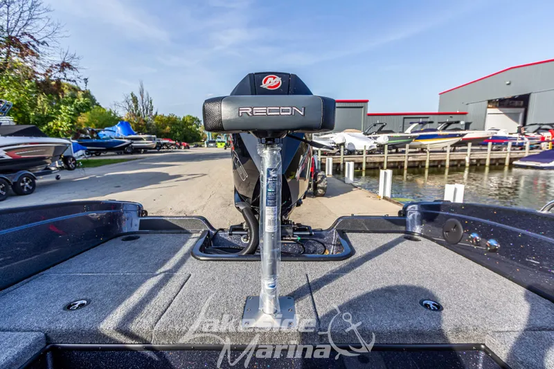 Slide: The Image of 2024 Recon 985 SC fishing boat at lakeside marina. - 15