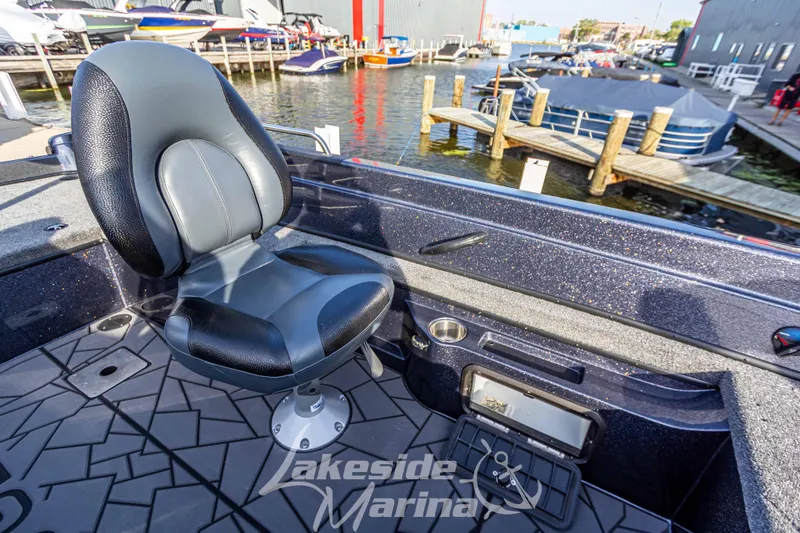 Slide: The Image of 2024 Recon 985 SC boat interior at Lakeside Marina, featuring a comfortable swivel seat. - 21