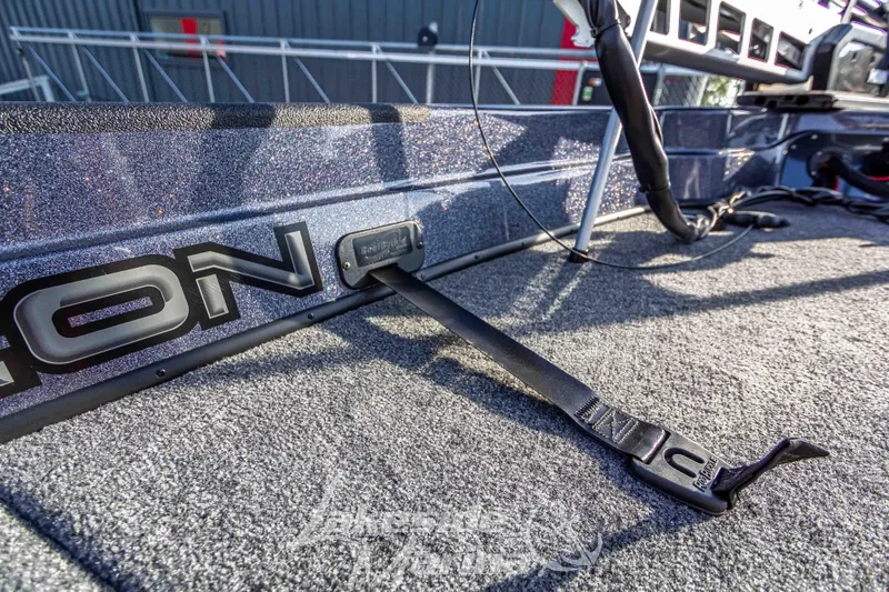 Slide: The Image of 2024 Recon 985 SC boat interior with secure strap and logo. - 28