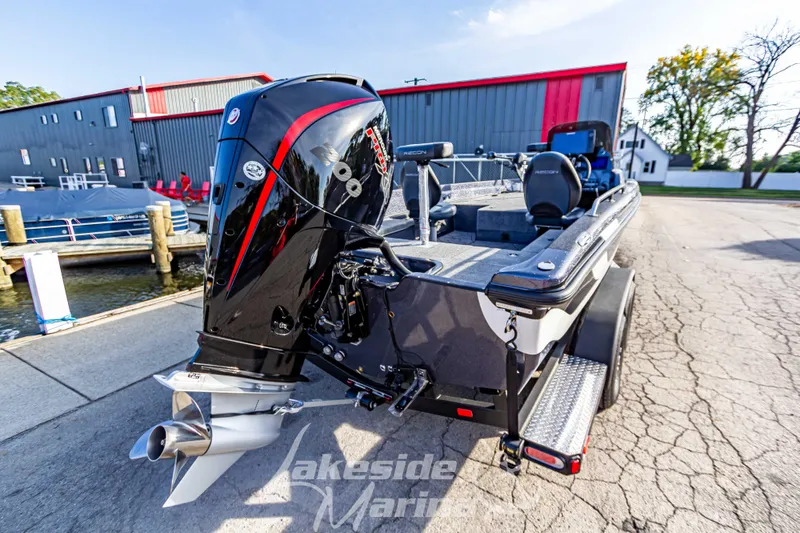 Slide: The Image of 2024 Recon 985 SC boat with powerful outboard motor at Lakeside Marina. - 4