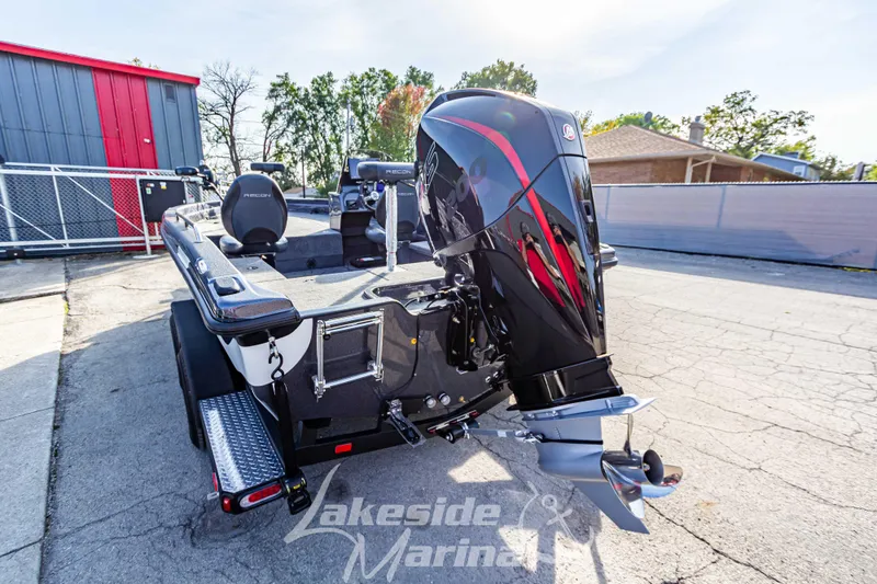 Slide: The Image of 2024 Recon 985 SC boat with powerful outboard motor at Lakeside Marina. - 6