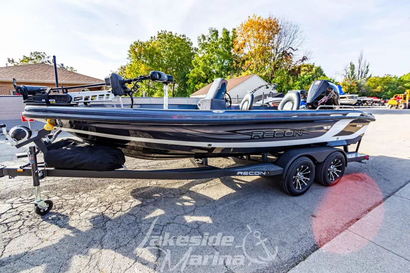 Slide: The Image of 2024 Recon 985 SC fishing boat on trailer at Lakeside Marina. - 8
