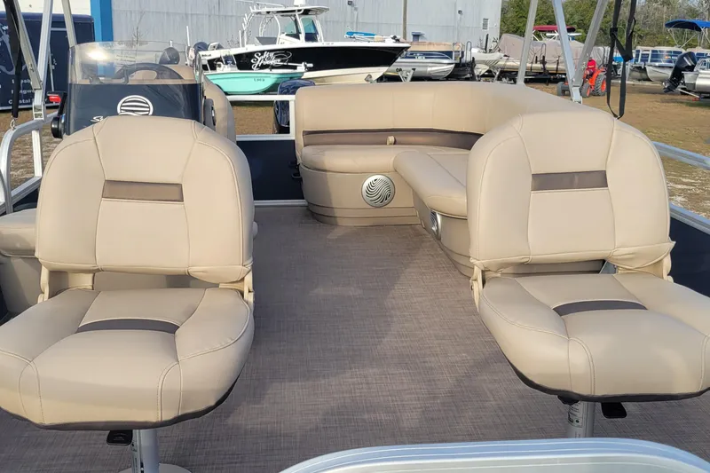 Slide: The Image of 2021 Sun Tracker Bass Buggy 16 XL Select pontoon boat interior with beige seating. - 6
