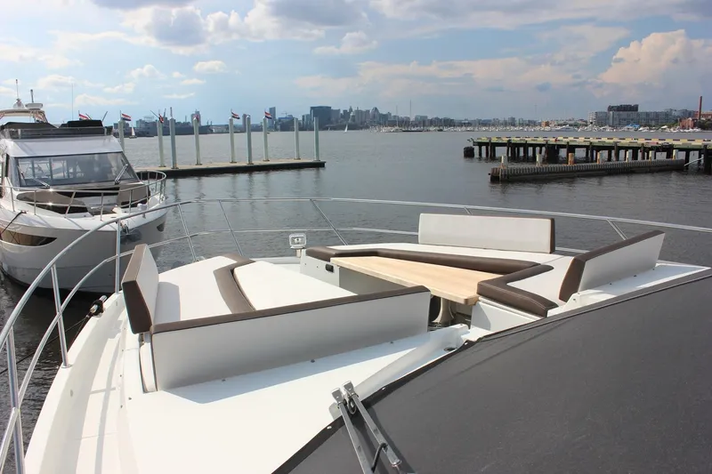 Slide: The Image of 2018 Galeon 640 Fly yacht docked, aerial view showcasing spacious deck and sleek design. - 12