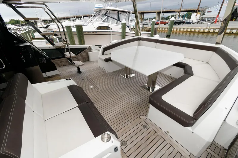 Slide: The Image of Galeon 640 Fly 2018 yacht docked, featuring spacious deck and modern design. - 14