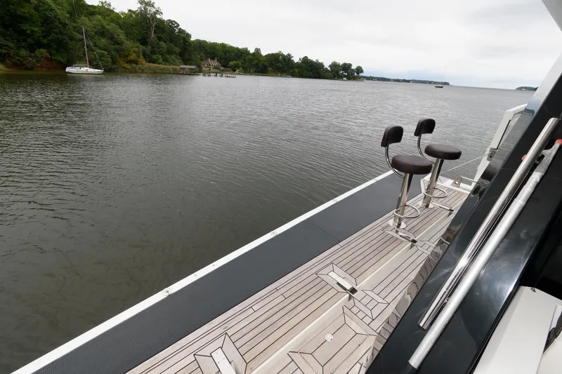 Slide: The Image of Spacious deck of 2018 Galeon 640 Fly yacht with elegant seating and table. - 18