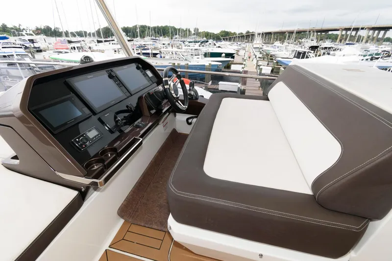Slide: The Image of Spacious deck of 2018 Galeon 640 Fly yacht with seating and tables. - 25