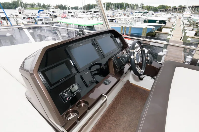 Slide: The Image of Spacious deck of 2018 Galeon 640 Fly yacht with seating and table. - 26