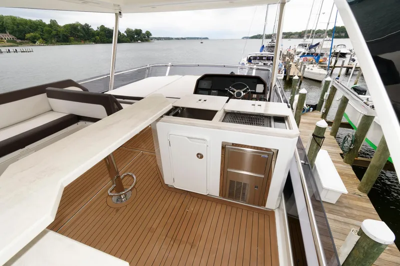Slide: The Image of Luxurious 2018 Galeon 640 Fly yacht with spacious deck and modern seating area. - 33
