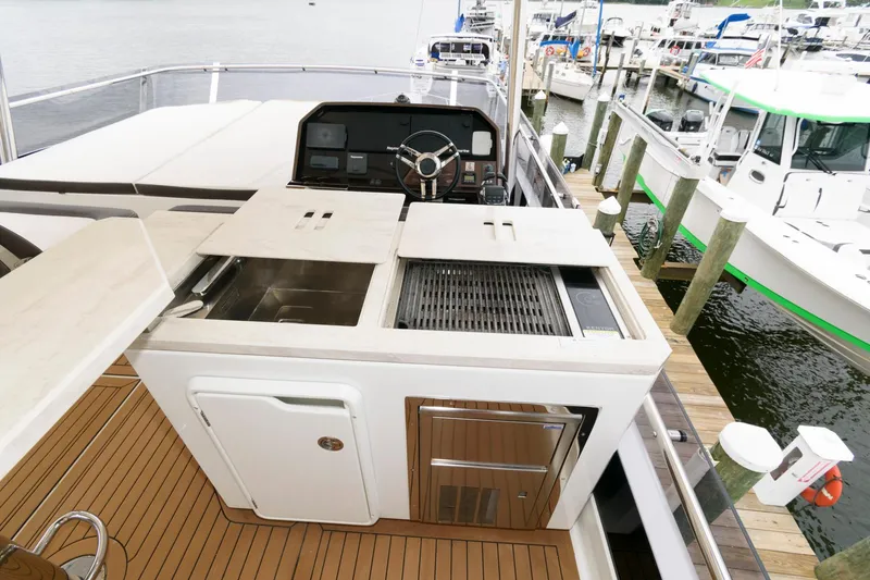 Slide: The Image of Luxurious 2018 Galeon 640 Fly yacht with spacious deck and elegant seating. - 34