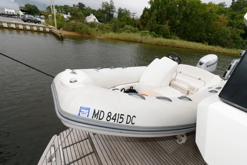 Slide: The Image of Luxurious 2018 Galeon 640 Fly yacht deck with bar stools and marina view. - 40