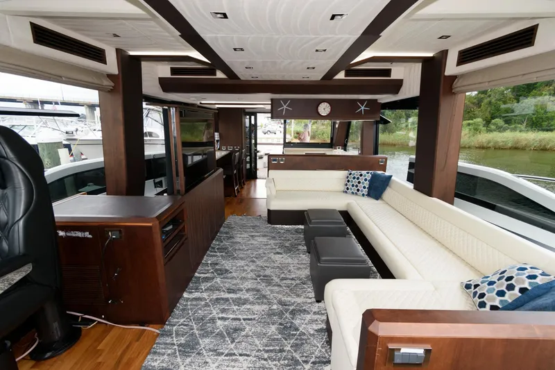 Slide: The Image of Luxurious interior of 2018 Galeon 640 Fly yacht with modern seating and panoramic windows. - 48