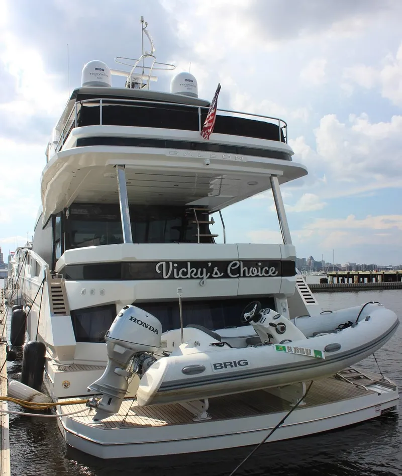 Slide: The Image of 2018 Galeon 640 Fly yacht docked at marina, showcasing sleek design and spacious decks. - 9