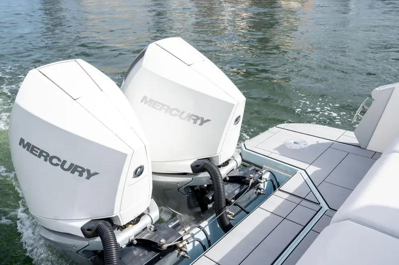Slide: The Image of 2022 Aviara AV32 OB boat with dual Mercury outboard engines on water. - 10