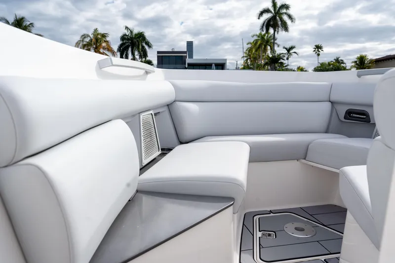 Slide: The Image of 2022 Aviara AV32 OB boat interior with luxurious white seating and modern design. - 11